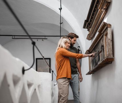 A couple is visiting a museum